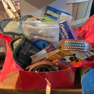 New! Box of dog grooming, a 3 latch leash, stickers, 2 raincoats, 1 mini coat